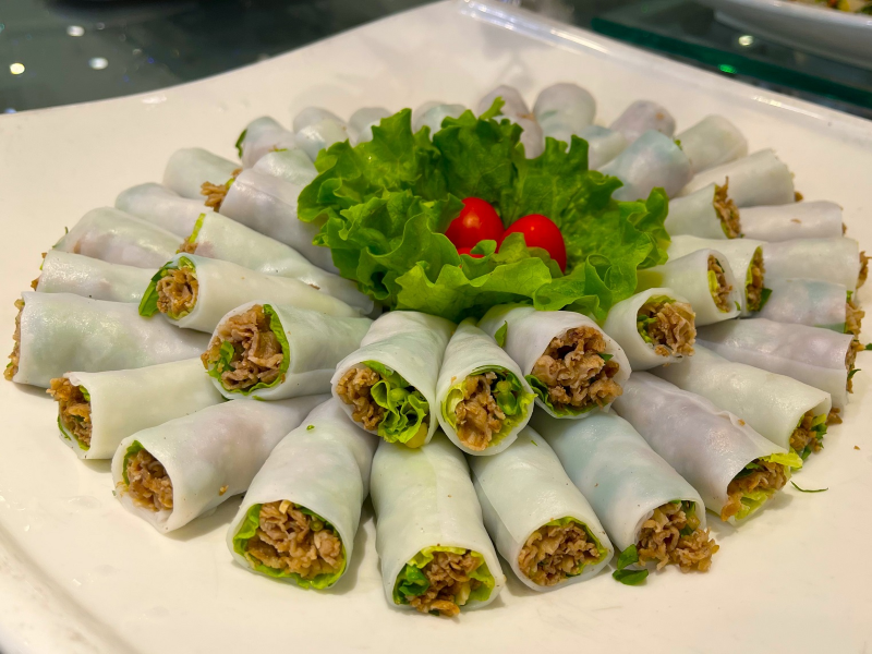 Eating pho rolls with dipping sauce