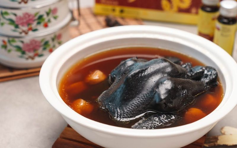 Black Chicken Recipes for Everyday MealsIf you're looking to try something new with black chicken, these innovative recipes are perfect for adding variety and flavor to your meals. From a hearty herbal soup to a refreshing salad, these dishes showcase the versatility of black chicken in exciting ways.
Black chicken soup with herbs and spices recipe
This nourishing black chicken soup with herbs and spices is perfect for those looking to enjoy a flavorful, wholesome dish. Packed with medicinal herbs and aromatic spices, it's a comforting meal that provides both warmth and wellness. Here's how to make it!
Ingredients:
To make a hearty and nutritious black chicken soup, you'll need a few key ingredients that bring both flavor and health benefits. Here’s a list of everything you'll need to prepare this delicious dish.
1 cut into pieces black chicken
10-12 cups water
2-3 slices fresh ginger
3-4 garlic cloves (smashed)
5-6 dried goji berries (optional for added nutrients)
2-3 dried red dates (jujube)
2-3 pieces dried shiitake mushrooms (optional)
1-2 pieces of angelica root (optional for medicinal benefits)
2-3 green onions (cut into 2-inch pieces)
Salt and pepper to taste
A little parsley or fresh cilantro for garnish
Black chicken soup with herbs and spices offers a nourishing and flavorful dish
Instructions:
Follow these easy steps to create a warming bowl of black chicken soup. From preparing the chicken to simmering the flavorful broth, these instructions will guide you through every step of the cooking process.
Step 1: Prepare the black chicken: Rinse the black chicken thoroughly under cold water, then cut it into pieces. If you prefer, you can blanch the chicken pieces in boiling water for 2-3 minutes to remove impurities and ensure a clearer broth. Drain and set aside.
Step 2: Prepare the broth: In a large pot, add 10-12 cups of water and bring to a boil. Add the ginger slices, garlic, goji berries, red dates, and any optional ingredients like dried mushrooms or angelica root. These herbs not only enhance the flavor but also add medicinal properties.
Step 3: Cook the chicken: Once the broth is boiling, add the prepared black chicken pieces. Lower the heat to a simmer cook for about 1.5 to 2 hours, and cover the pot. The longer you simmer, the more tender the chicken and flavorful the broth will be.
Step 4: Season the soup: After the soup has simmered for the desired time, add salt and pepper to taste.
Step 5: Serve and garnish: Ladle the soup into bowls, ensuring each bowl has a good mix of chicken and herbs. Decor soup with fresh cilantro or parsley for an extra touch of color.