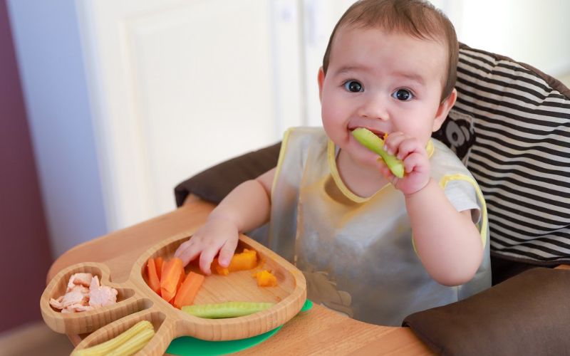 Prioritize safety with secure seating, proper food prep, close supervision, and first aid knowledge in baby-led weaning
